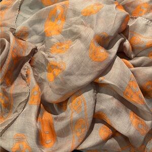 Alexander McQueen. Silk. Lightweight Beige Scarf with Orange Skull Print